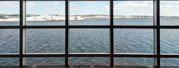 Large floor-to-ceiling windows overlooking Halifax Harbour in winter