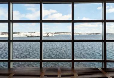 Large floor-to-ceiling windows overlooking Halifax Harbour in winter