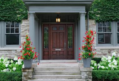 Elegant brown wood-grain front door enhancing curb appeal of a Canadian residential home