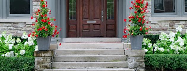 Elegant brown wood-grain front door enhancing curb appeal of a Canadian residential home