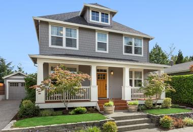 Craftsman-style home exterior with residential windows on a bright sunny day in Charlottetown