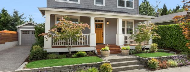 Craftsman-style home exterior with residential windows on a bright sunny day in Charlottetown