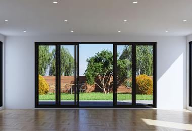 Modern living room with folding patio glass doors connecting the indoor space to the outdoor patio.