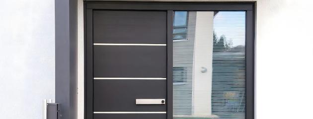 Modern steel front entry door on a residential home, illustrating Ontario front door replacement cost factors in 2026.