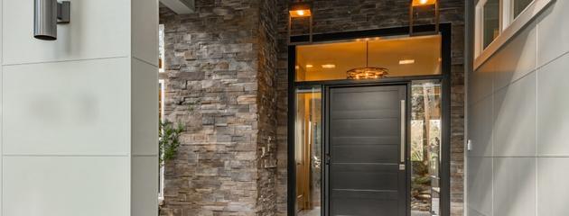 Front door with sidelights adds natural light and curb appeal to a Canadian home entryway