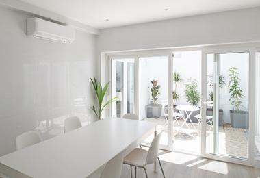 Modern kitchen and dining area with large sliding glass doors