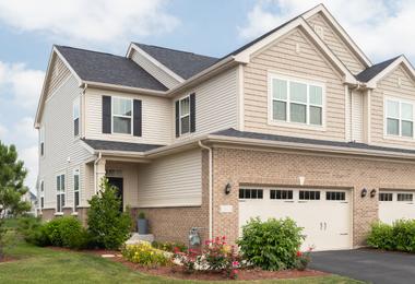 Large suburban home with vinyl siding and modern window configuration in Vaughan, showcasing residential window design