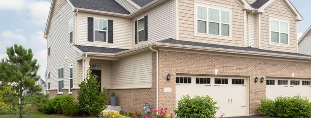 Large suburban home with vinyl siding and modern window configuration in Vaughan, showcasing residential window design