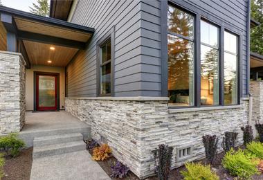 Modern residential home with large tilt and turn windows and clean architectural lines