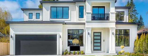 Modern home with large windows showcasing contemporary window design in Canadian conditions.