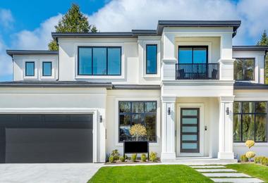 Modern home with large windows showcasing contemporary window design in Canadian conditions.