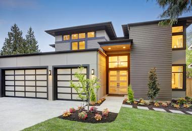 Modern residential home exterior illustrating how new windows and doors can improve curb appeal, comfort, and resale value for Canadian homeowners.