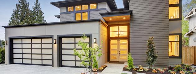 Modern residential home exterior illustrating how new windows and doors can improve curb appeal, comfort, and resale value for Canadian homeowners.