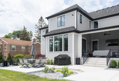 Modern luxury Canadian home exterior with large premium energy-efficient windows at sunset