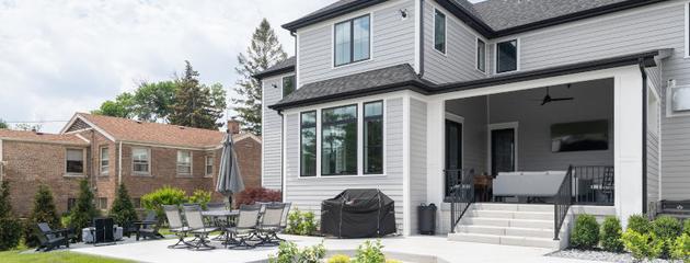 Modern luxury Canadian home exterior with large premium energy-efficient windows at sunset