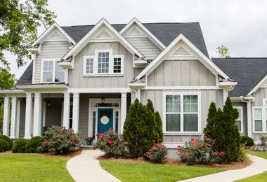 Single-family new construction home in suburban neighbourhood with modern windows and exterior finish