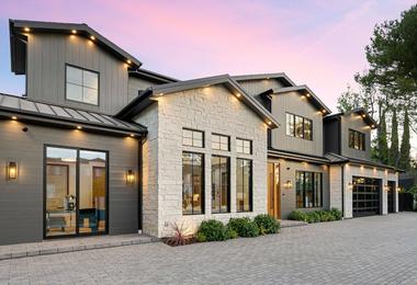 Modern luxury home exterior featuring stylish windows at sunset in Canada