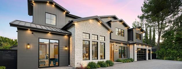 Modern luxury home exterior featuring stylish windows at sunset in Canada