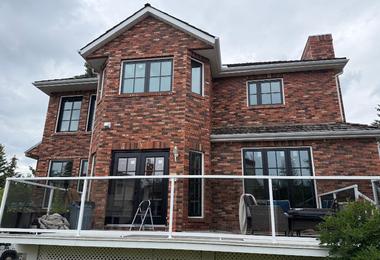 Triple-pane windows installed on a residential home in Calgary, designed to improve comfort during wind and temperature swings