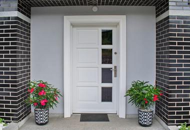 Standard white front door on a modern Canadian home
