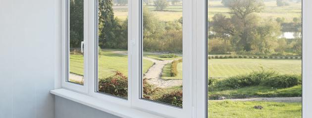 Residential home in Oshawa with aging windows exposed to harsh weather conditions that contribute to faster window wear and deterioration