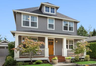 Craftsman-style home in Whitby with large windows designed to withstand wind load and protect against harsh weather conditions