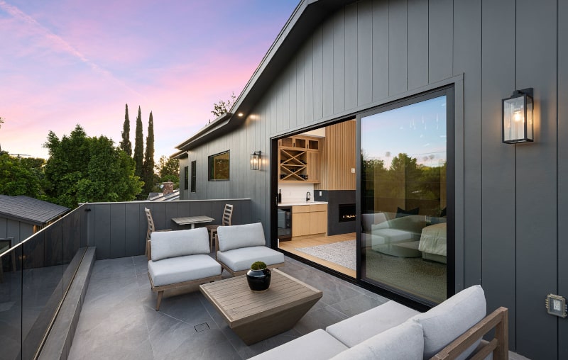 Outdoor seating area with sliding glass doors and modern patio design