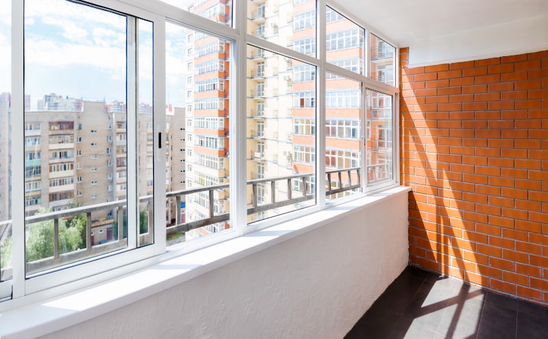 Balcony view with large sliding windows in a modern residential setting