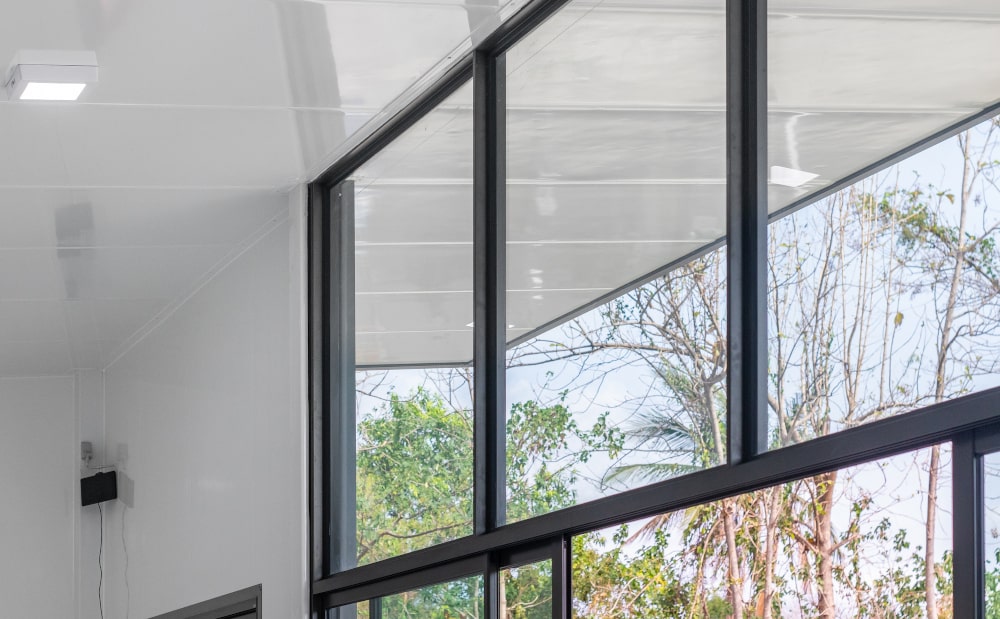 Horizontal clerestory windows near the roofline for natural light