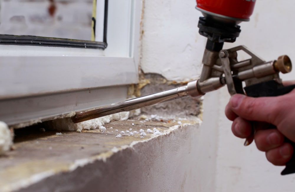 Careful removal of an old exterior window sill to avoid damage to the window frame