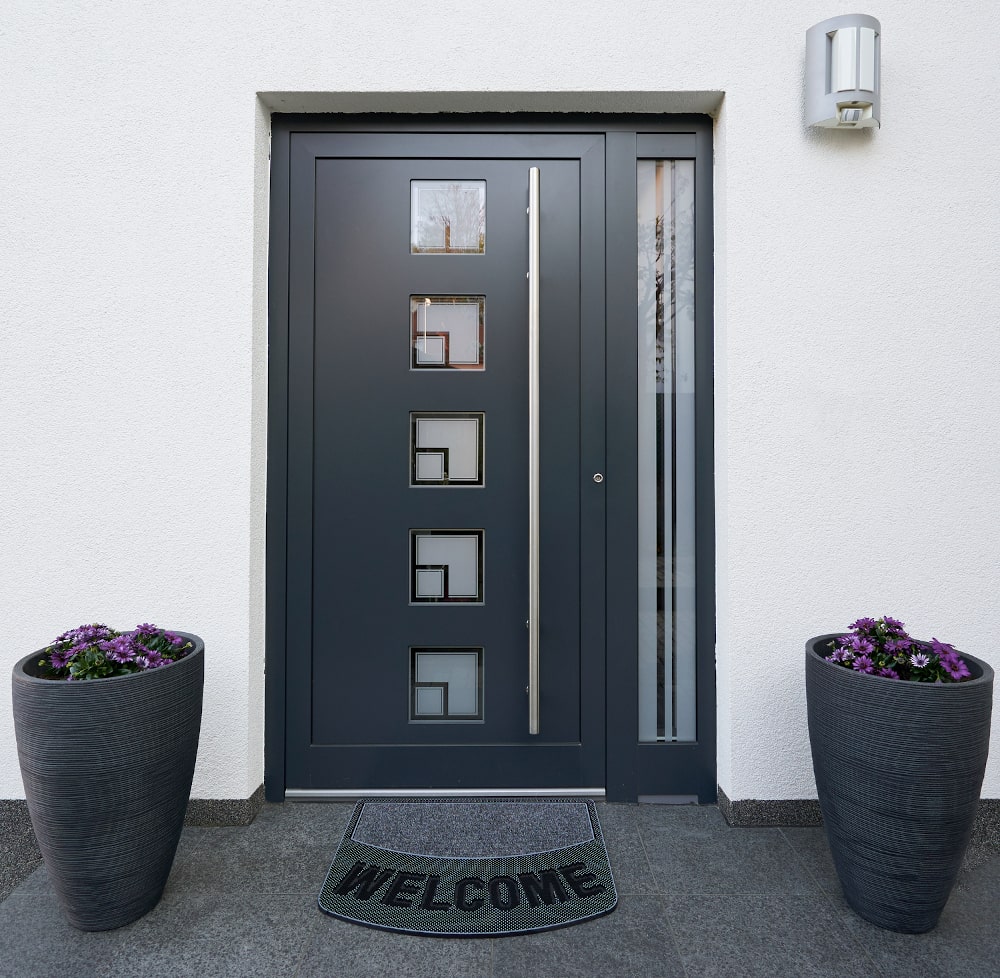 Front door with clean lines and minimalist panel design reflecting modern 2026 trends in Canadian homes