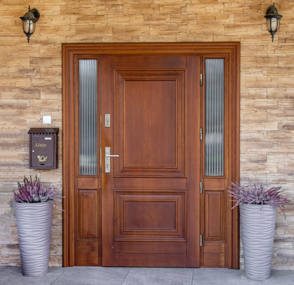 Modern home entry with a natural wood front door showing warm textures and 2026 design trends