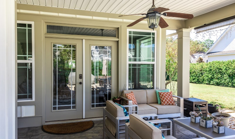 Custom patio door designed to fit unique opening dimensions Custom-built patio door system with wide glass panels in a new construction home