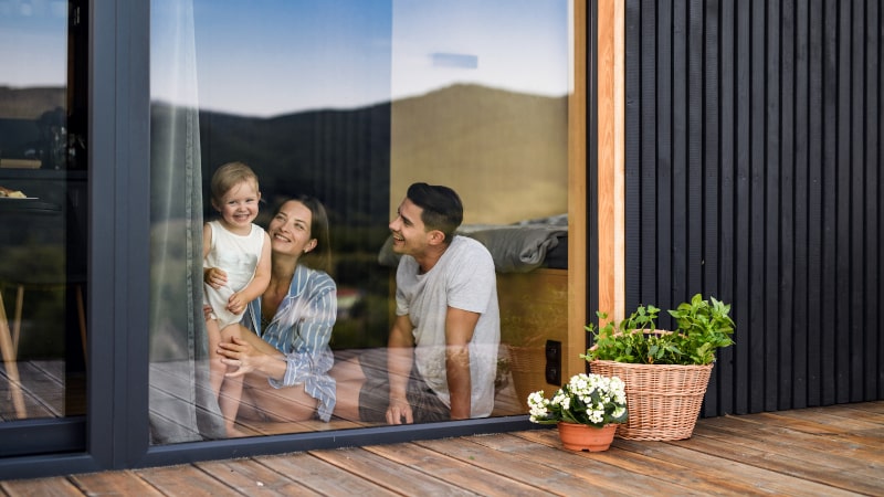 Family relaxing in a quiet and comfortable passive house interior