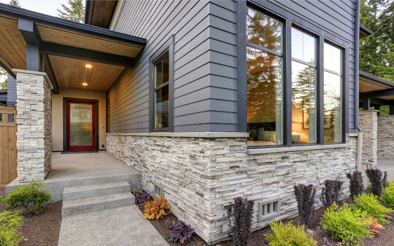 Home exterior with modern curb appeal showing how upgraded windows and doors can increase buyer confidence and perceived property value in Canada.