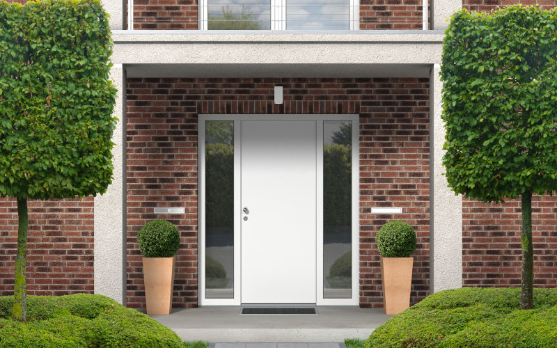 Front entrance of a brick home showing a steel entry door style commonly chosen in Ontario for durability, security, and energy efficiency.