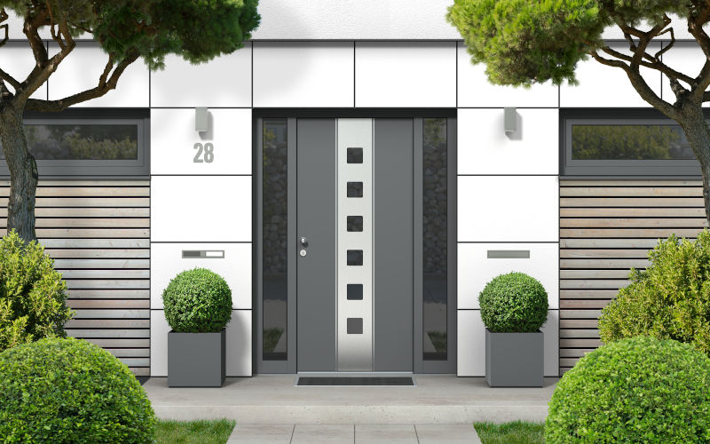 Residential home exterior representing full front door replacement with professional installation, sealing, and trim finishing in Ontario.