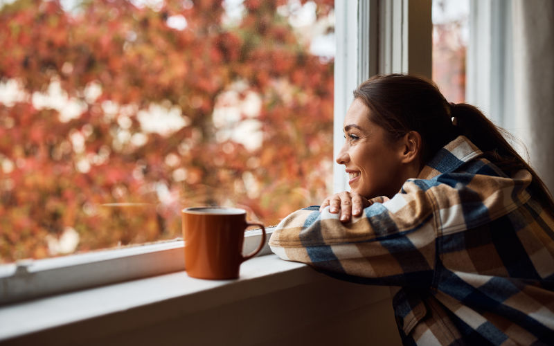 Bright and comfortable interior view through large windows in a Canadian home after resolving crying windows and condensation problems.