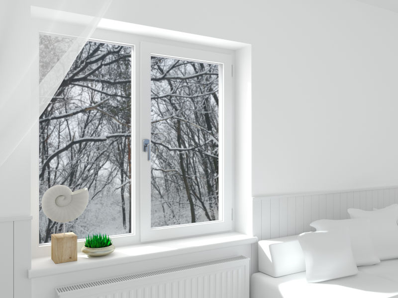 Interior view of double pane window during cold winter conditions, highlighting potential condensation and edge performance