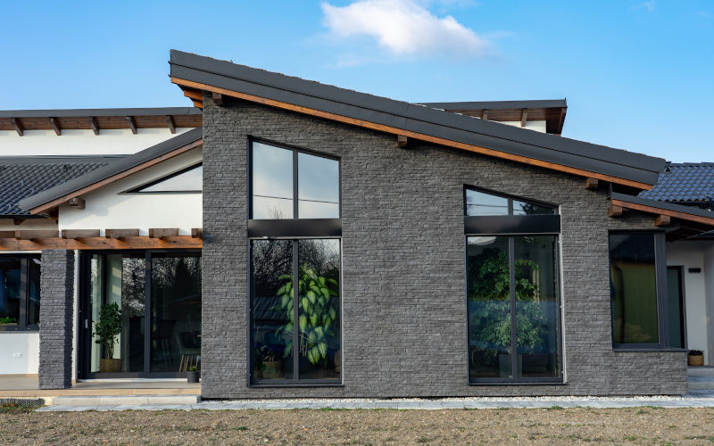 Contemporary house with large tilt and turn windows blending indoor comfort and outdoor ventilation