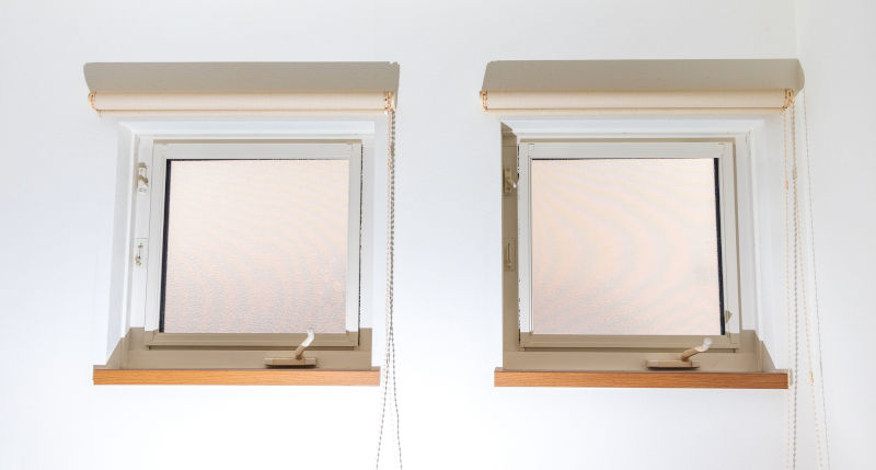 Top-hinged awning windows opened outward for ventilation.