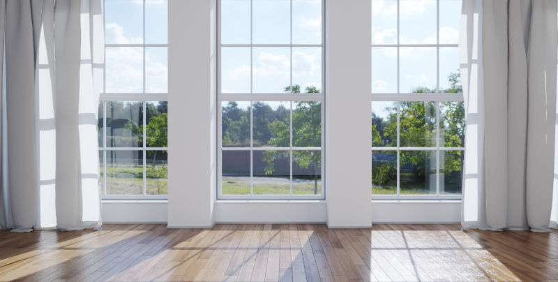 Large picture window providing unobstructed natural light in a modern living room.