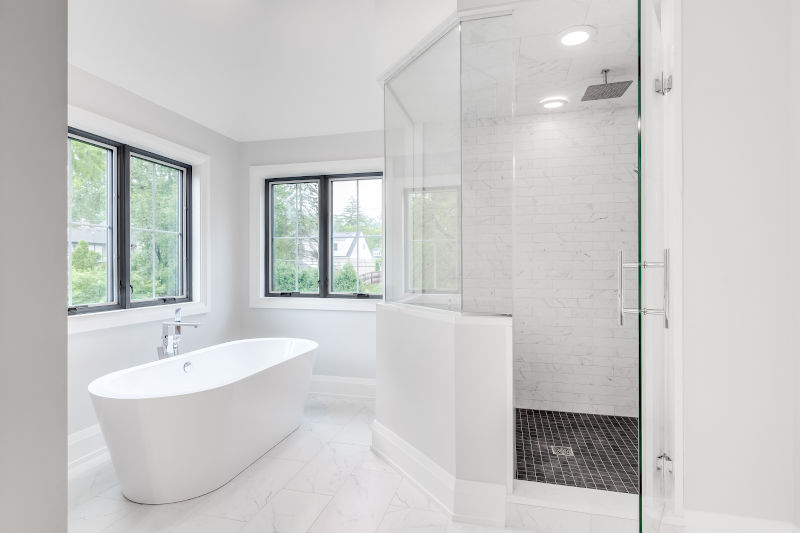 Corner shower window design bringing natural light into a modern bathroom while maintaining privacy