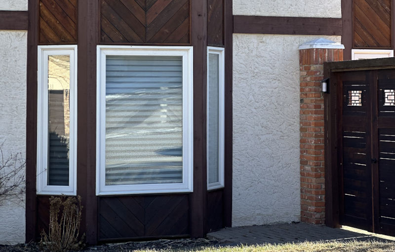 Homeowner discussing window replacement financing options in Calgary with a consultant