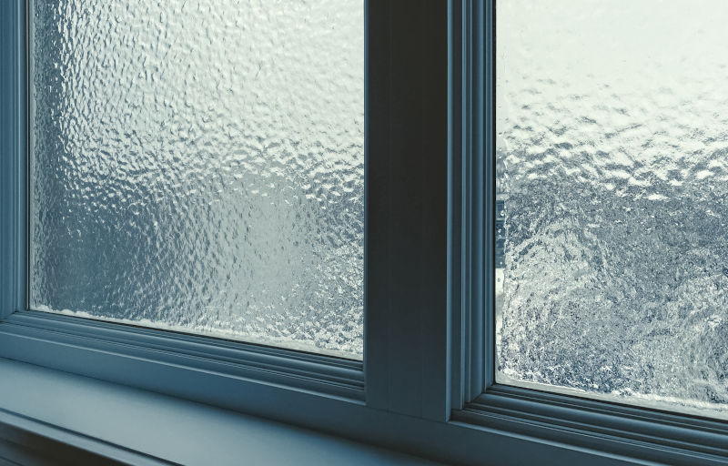 Frosted privacy glass window providing natural light while blocking outside visibility