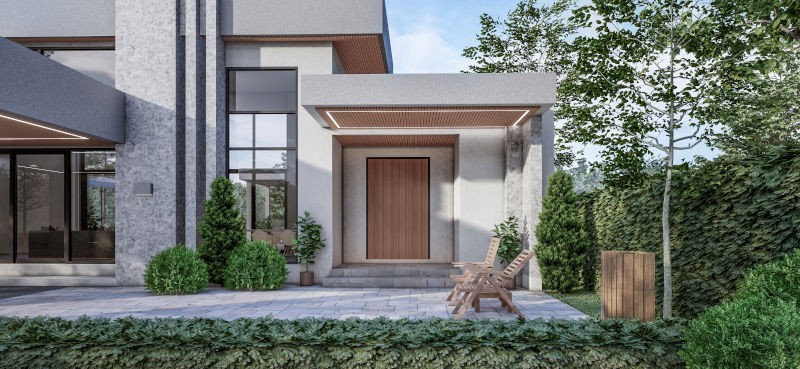 Contemporary home entrance featuring an oversized modern front door and glass elements