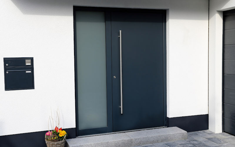 Anthracite grey steel front door with modern hardware and clean lines