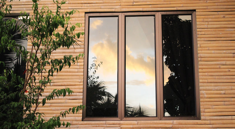 Reflective one-way mirror window film providing daytime privacy and exterior visibility control