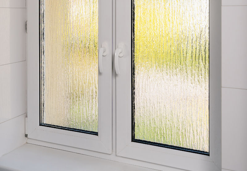 Modern window featuring textured patterned glass for privacy and decorative appeal