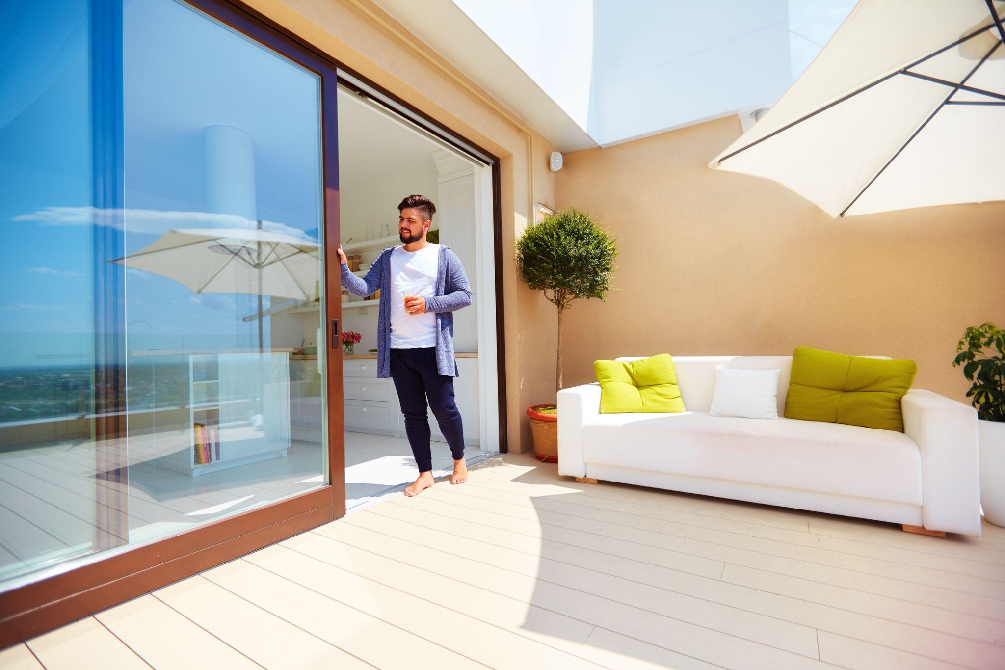 Modern sliding patio door with energy-efficient glass that improves indoor comfort, reduces heat transfer, and increases natural daylight.